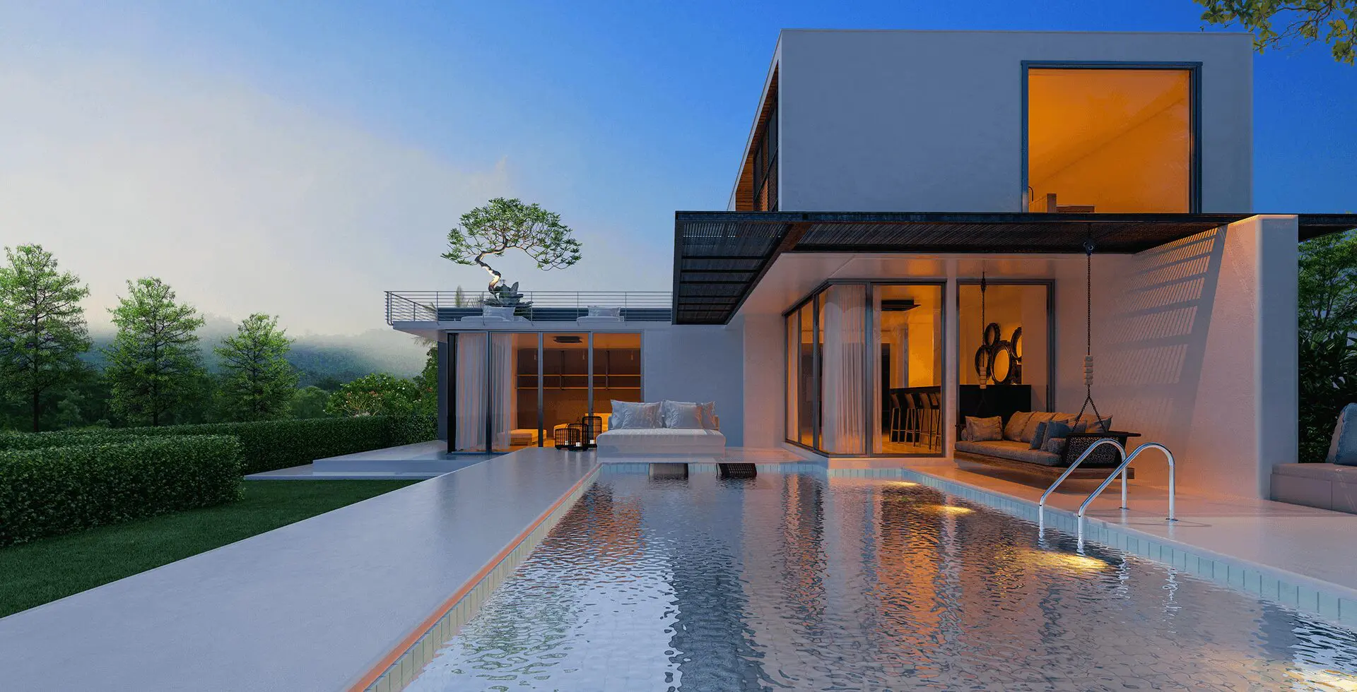 Modern house with pool at sunset.